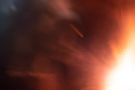 Blurred image Sun flare on the black backgroundの写真素材