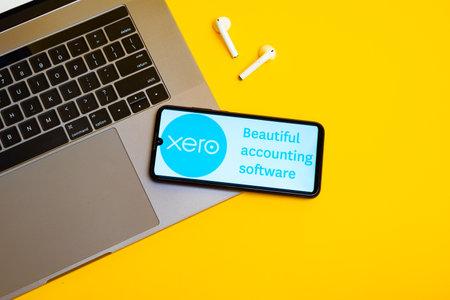 Kyoto city, Japan - July 31, 2023: Xero displayed on a smartphone near modern laptop on yellow backgroundのeditorial素材