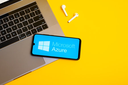 Kyoto city, Japan - July 31, 2023: Apple iPhone with Microsoft Azure logo on the screen on yellow backgroundのeditorial素材
