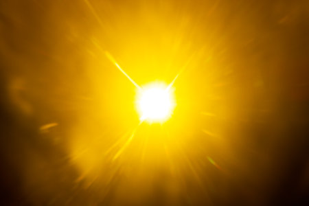 Blurred image Sun flare on the black backgroundの写真素材