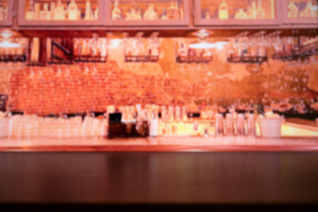 Wooden table on blur of cafe image, coffee shop, bar, background - can be used for display or montage your productsの写真素材