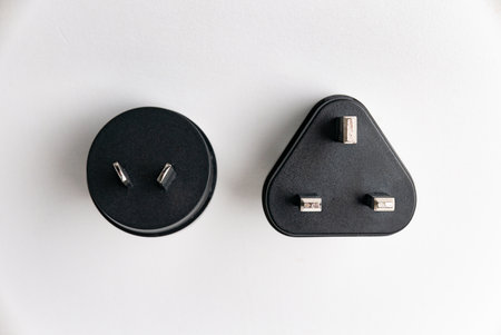 Adapter for English type G and I socket isolated on white background