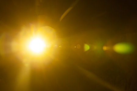 Sun flare on the black backgroundの写真素材