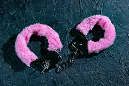 Pink fluffy handcuffsの写真素材