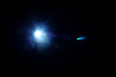 Sun flare on the black backgroundの写真素材