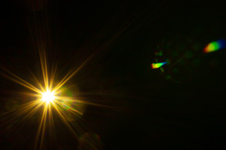Sun flare on the black backgroundの写真素材