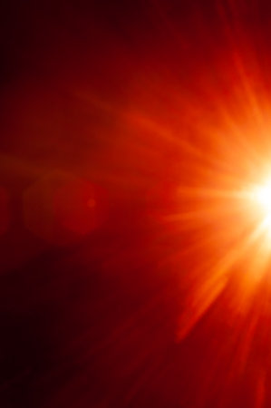 Sun flare on the black backgroundの写真素材