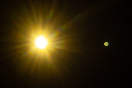Sun flare on the black backgroundの写真素材