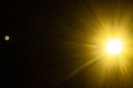 Sun flare on the black backgroundの写真素材