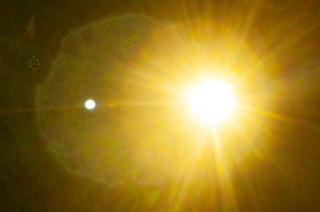 Sun flare on the black backgroundの写真素材