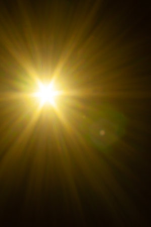 Sun flare on the black backgroundの写真素材