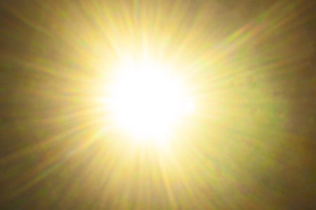 Sun flare on the black backgroundの写真素材