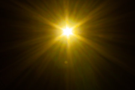 Sun flare on the black backgroundの写真素材