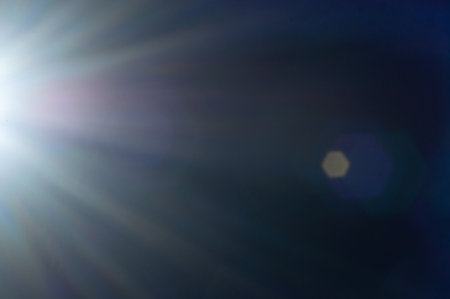 Sun flare on the black backgroundの写真素材