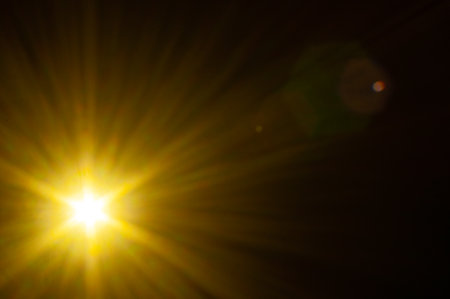 Sun flare on the black backgroundの写真素材