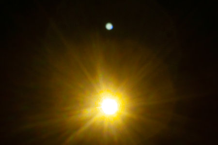 Sun flare on the black backgroundの写真素材