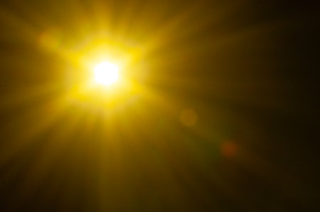 Sun flare on the black backgroundの写真素材