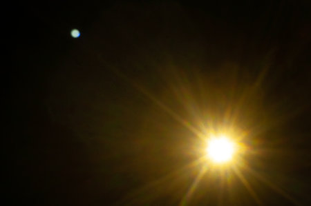Sun flare on the black backgroundの写真素材