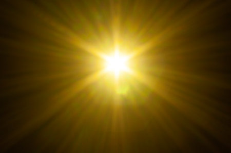 Sun flare on the black backgroundの写真素材