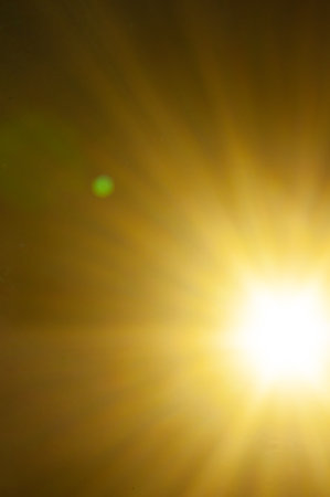 Sun flare on the black backgroundの写真素材