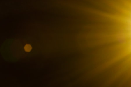 Sun flare on the black backgroundの写真素材