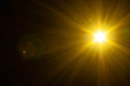Sun flare on the black backgroundの写真素材