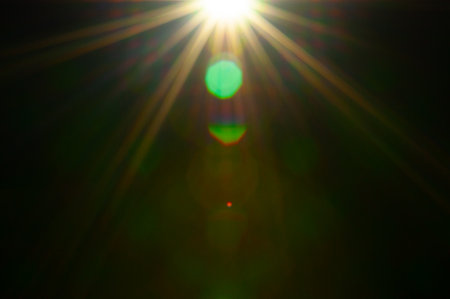 Sun flare on the black backgroundの写真素材