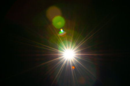Sun flare on the black backgroundの写真素材