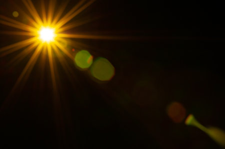 Sun flare on the black backgroundの写真素材