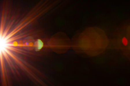 Sun flare on the black backgroundの写真素材
