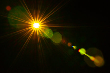 Sun flare on the black backgroundの写真素材