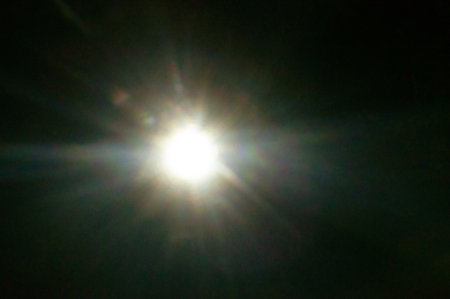 Sun flare on the black backgroundの写真素材