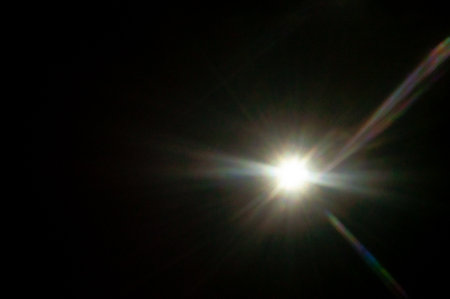 Sun flare on the black backgroundの写真素材