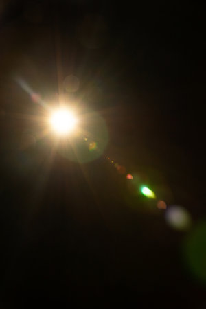 Sun flare on the black background
