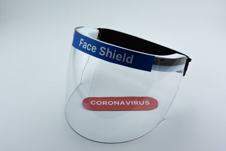 Face shield on a white background. Pandemic COVID-19 virus and protection against coronavirus concept.の写真素材