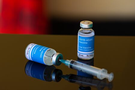 Vaccine and syringe injection for vaccination. Live vaccine for the coronavirus concept.の写真素材