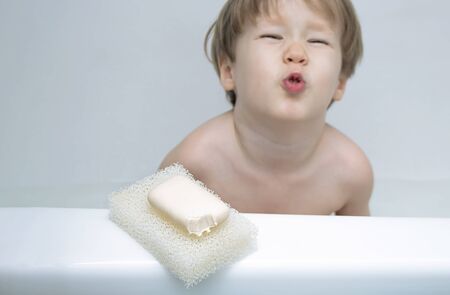 Bar soap with tooth marks closeup. small child boy bit off bar of soap and bit his mouth. Humor...