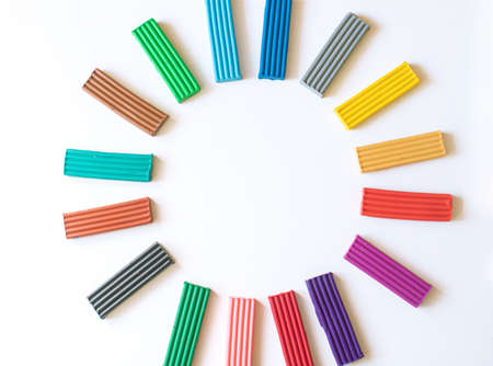 sun or circle of colored plasticine bars on a white backgroundの写真素材