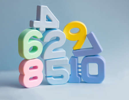 pyramid of plastic volumetric figures blue backgroundの写真素材