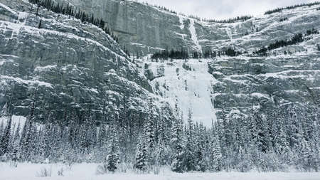 Snow-capped mountains along Trans-Canada Highway in Banff National Park in Alberta, Canadaの写真素材