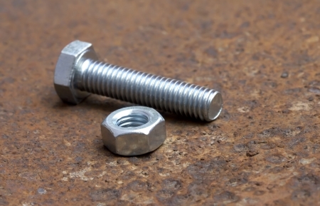 Bolt and nut on rusty metal