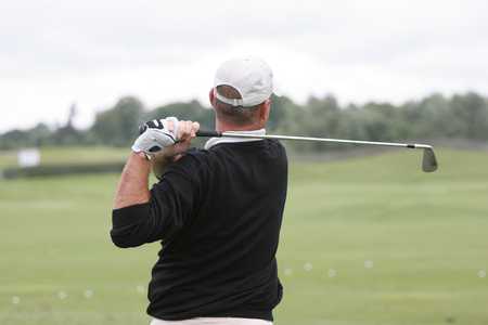 man golf swing on the courseの写真素材