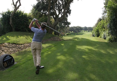 man golf swing on the courseの写真素材