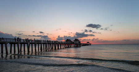 NAPLES, UNITED STATES, NOVEMBER 30, 2017 : pier jetty at sunset , november 30, 2017, in Naples, Florida, united statesのeditorial素材