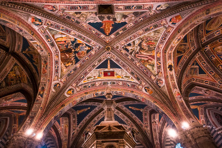 SIENA, ITALY, JUNE 12, 2016 : interiors and architectural decors of the baptistery, Siena cathedral, june 12, 2016 in Siena, Italyのeditorial素材