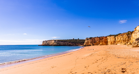 Beach and cliffs of Senhora da rocha, in Lagoa, Algarve, Portugalの写真素材