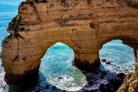 Beach and cliffs of Marinha, in Lagoa, Algarve, Portugalの写真素材