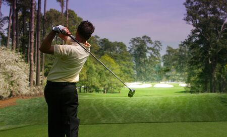 man golfer in action on a golf courseの写真素材
