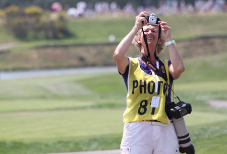 GUYANCOURT , FRANCE, JULY 04, 2015 : photographer During the third round of the French Open, European golf tour, July 04, 2015 at The golf National, Guyancourt, France.のeditorial素材