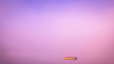 view of a boat dock the Lac-Superieur, misty morning with fog, in Laurentides, Mont-tremblant, Quebec, Canadaの写真素材